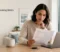 rentgrow-tenant-screening-errors-featured-image Renter reviewing a tenant screening report beside a laptop and apartment keys.